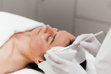 Cosmetology beauty procedures. Lady receiving rejuvenation anti aging treatment, facial chemical...