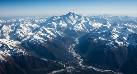 Aerial View of a Snow Covered Mountain Range and Valley