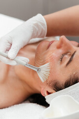 Cosmetology beauty procedures. Lady receiving rejuvenation anti aging treatment, facial chemical...