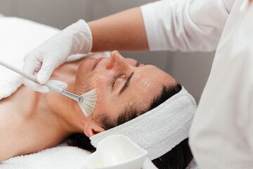 Cosmetology beauty procedures. Woman receiving rejuvenation anti aging treatment, facial chemical...