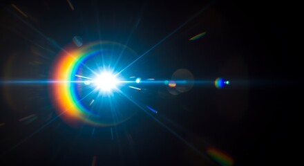 Fototapeta premium Bright Blue Lens Flare with Rainbow Effect on Black Background