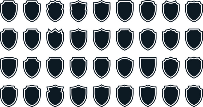 Set of blank black shield silhouettes. Vector icon collection of security badges, medieval crests, protection emblems for design and branding