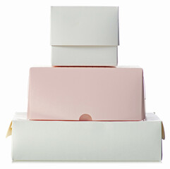 Stack of cardboard white brown pink boxes on white background isolation