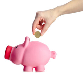 Pink piggy bank with gold coin in hand on white background isolation