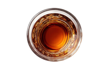 Amber liquid swirls in a crystal glass against a black backdrop a top down view showcasing rich color and texture