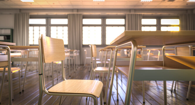 Empty classroom is bathed in warm sunlight shining through large windows, creating a peaceful atmosphere