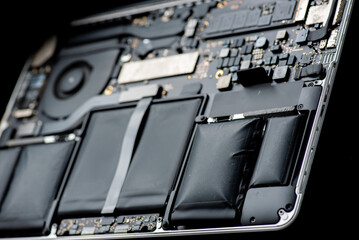 The laptop battery is worn out and showing signs of swelling. It needs to be replaced.