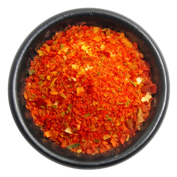 Top view of peri-peri spice blend in black ceramic bowl, isolated on transparent background, ideal for cooking ingredient visuals, spicy seasoning packaging, or culinary product mockups