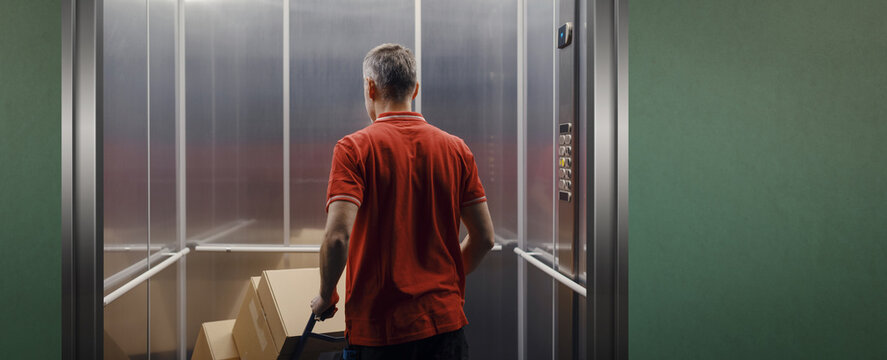 Delivery man getting in the elevator
