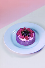 Bright fruit and berry cake with cream on shortcrust pastry