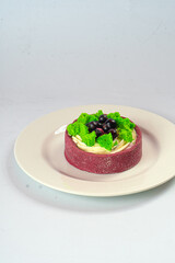 Bright fruit and berry cake with cream on shortcrust pastry