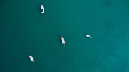 Aerial View of Several Boats Anchored in Turquoise Water