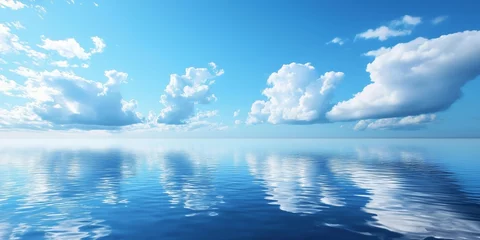 A serene view of the ocean with fluffy clouds reflecting beautifully in the calm water's surface.