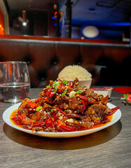 Spicy stir-fried pork with chili and sweet and sour sauce
