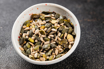 Seed mix pumpkin seeds, sunflower seeds superfood natural food dish organic fresh tasty gourmet food background on the table rustic food top view copy space vegetarian vegan food keto paleo diet