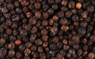 Black pepper background, top view texture