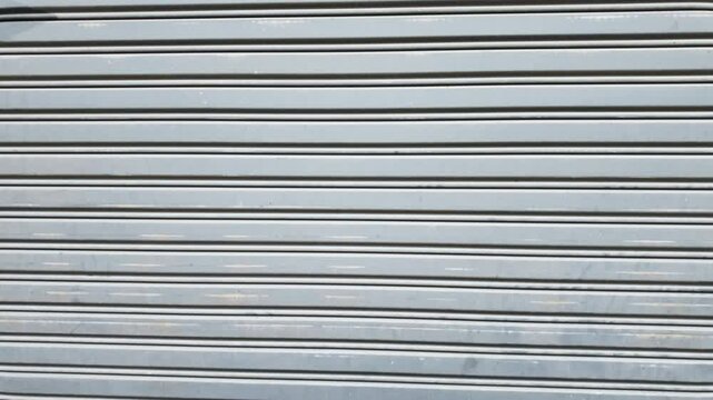Exterior old metallic roller shutter door background
