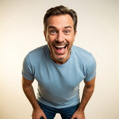 Obraz premium Excited and Happy Middle-Aged Man Laughing Looking Up at Camera with Wide Smile