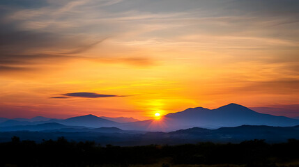 Obraz premium Sunrise Over Silhouetted Mountains