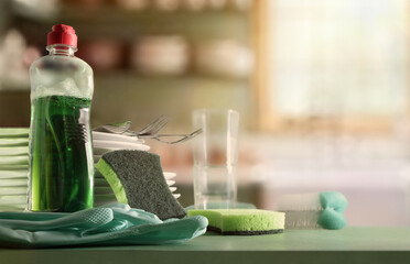 Traditional tableware washing concept with products on a green kitchen