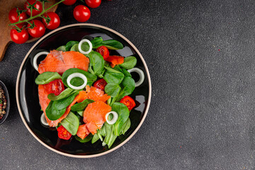Salmon salad fresh seafood appetizer vegetables dish fresh tasty gourmet food background on table rustic food top view copy space keto and paleo diet vegetarian food pescetarian diet