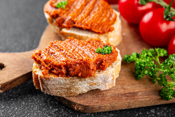 Pepper pate red pepper dip roasted vegetable hummus appetizer vegetables dish fresh gourmet food background on table rustic food top view copy space keto and paleo diet vegetarian and vegan food
