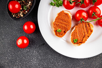 Pepper pate red pepper dip roasted vegetable hummus appetizer vegetables dish fresh gourmet food background on table rustic food top view copy space keto and paleo diet vegetarian and vegan food