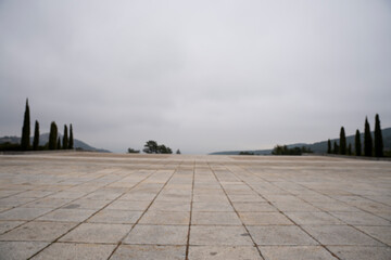 Valle de los Caídos: Majestic Cross in Misty Mountains