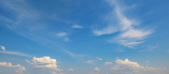 Bright blue sky with white clouds.
