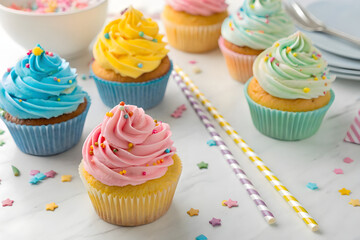 colorful cupcakes with swirled frosting and rainbow sprinkles, arranged in a playful kids party setting. Bright, festive, and sweet perfect for birthday themes, dessert promotions