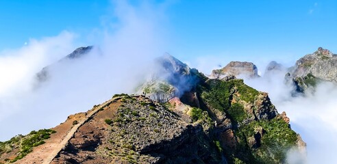Panoramic view of the beginning of the famous hiking trail from Pico Arieiro to Pico Ruivo on Madeira, covered in clouds