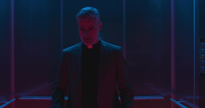 A priest gets stuck in a broken elevator, he joins hands in prayer and a miracle happens: the elevator is back in service