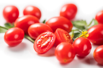 Cherry tomatoes, Fresh Ripe natural little tomatoes close-up. Organic tomato with leaves isolated on white background. Macro shot. Garden, Gardening concept. Ketchup, pasta, sauce ingredient 