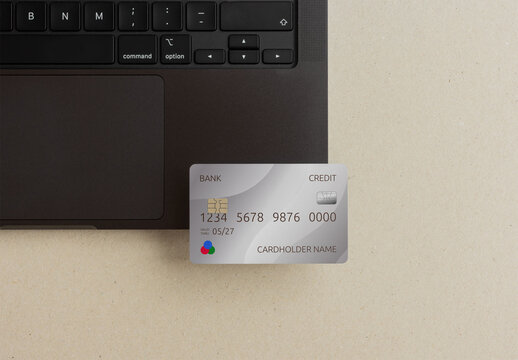 Mockup of ATM credit Card Positioned Near a Laptop