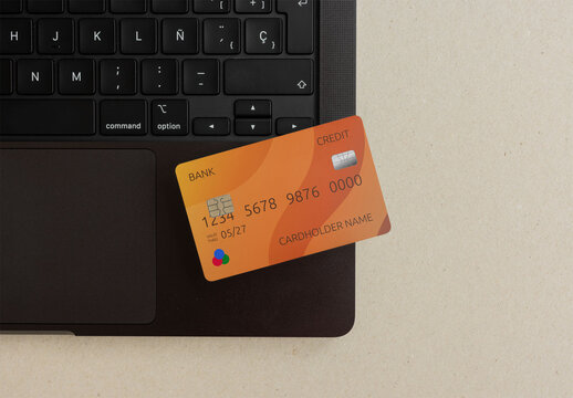 Mockup of Blank debit ATM Card on Laptop Surface