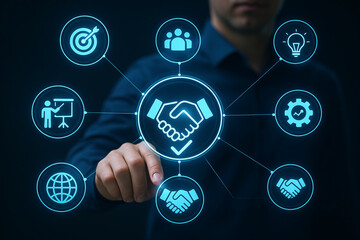 Businessman selecting digital handshake icon among network of business strategy symbols representing successful partnerships and collaboration.