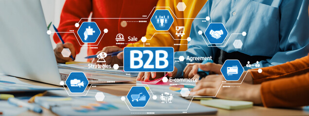 A dynamic scene of business professionals engaged in B2B strategy discussions, enhanced by digital...