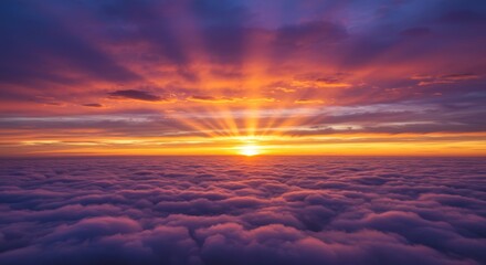 Obraz premium Heavenly Sunrise Above the Clouds - Stunning sunrise view from above the clouds, showcasing vibrant colors and sun rays. A breathtaking, peaceful scene