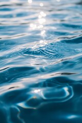 Rippled pool water reflecting sunlight