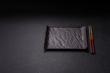 An empty plate with chopsticks for Japanese or Chinese food