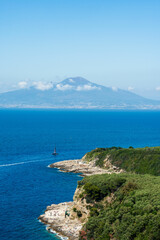 Coastline of Puolo beach in Massa Lubrense with Vesuvius in the distance. Naples,. Italy