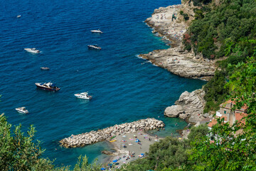 Obraz premium Coastline of Puolo beach in Massa Lubrense with Vesuvius in the distance. Naples,. Italy