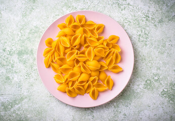 Raw pasta in shape of shells