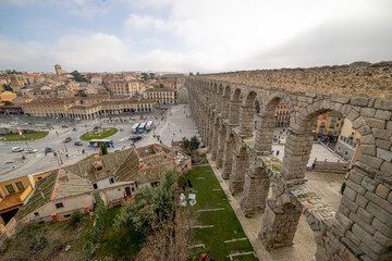 Panoramic View of Segovia Aqueduct with Tourists in Urban Center