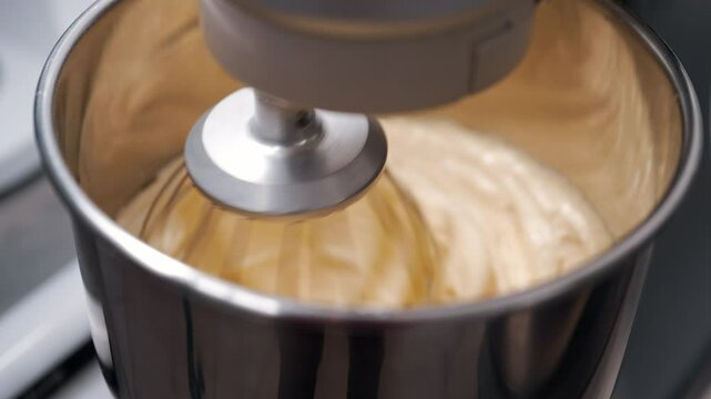 Stand mixer mixing gluten-free almond batter. Smooth base, vegan healthy baking