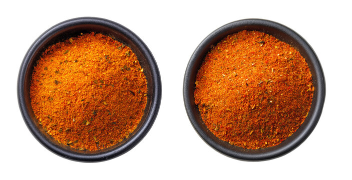 Top view of taco seasoning spice blend in black ceramic bowls, vibrant orange-red mix with herbs and chili, isolated on ransparent background, ideal for Tex-Mex cuisine visuals