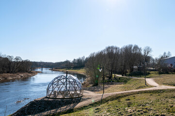 Secluded riverside structure invites relaxation during bright sunny day in early spring © ako-photography