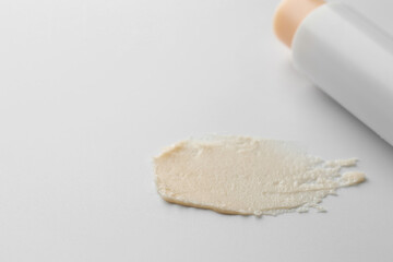 Stick of lip balm and sample on white background, closeup. Space for text
