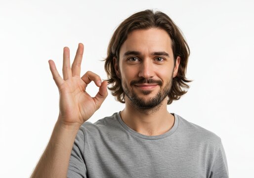 Handsome man showing ok sign gesture and smiling for advertising and web design, great for product approval, acceptance, good news, success and quality concept