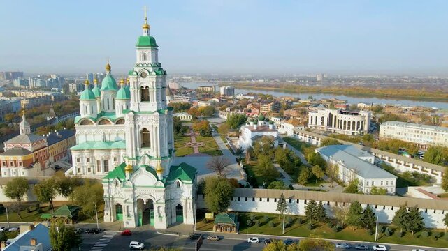 Aerial video panorama of Astrakhan Kremlin, Russia, featuring historic white stone walls, and beautiful view of Volga river.
